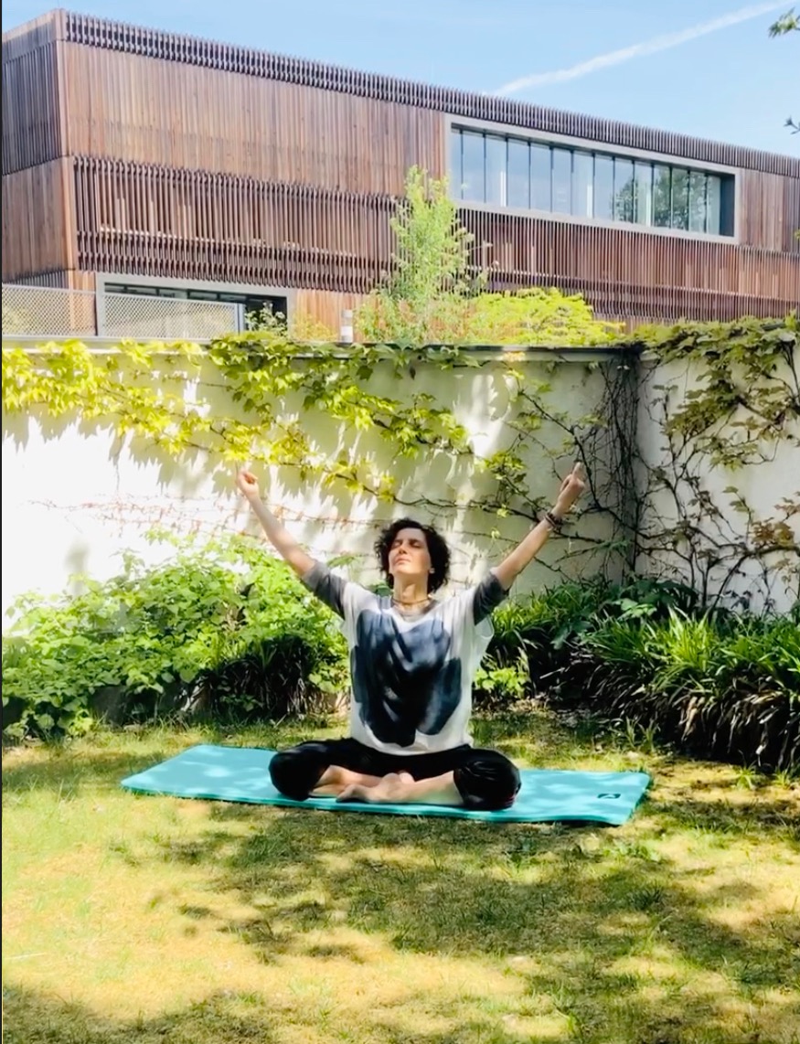 Mata Sakka leading an outdoor movement and yoga practice